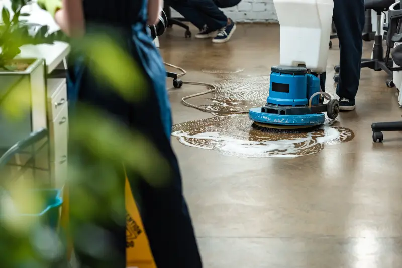 cleaners doing commercial cleaning in a warehouse